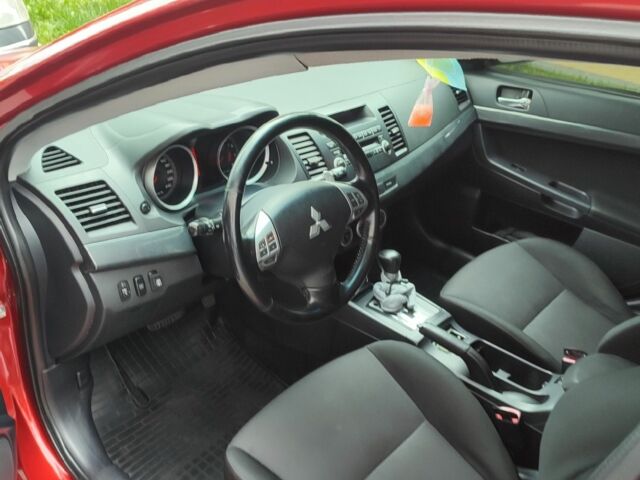 Червоний Міцубісі Lancer, об'ємом двигуна 2 л та пробігом 257 тис. км за 6900 $, фото 4 на Automoto.ua