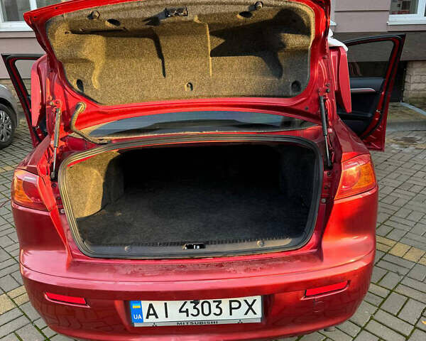 Красный Мицубиси Лансер, объемом двигателя 2 л и пробегом 143 тыс. км за 5200 $, фото 4 на Automoto.ua