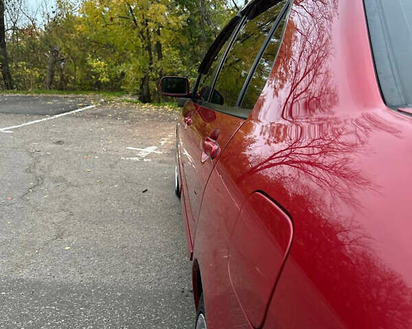 Красный Мицубиси Лансер, объемом двигателя 1.6 л и пробегом 192 тыс. км за 5999 $, фото 4 на Automoto.ua