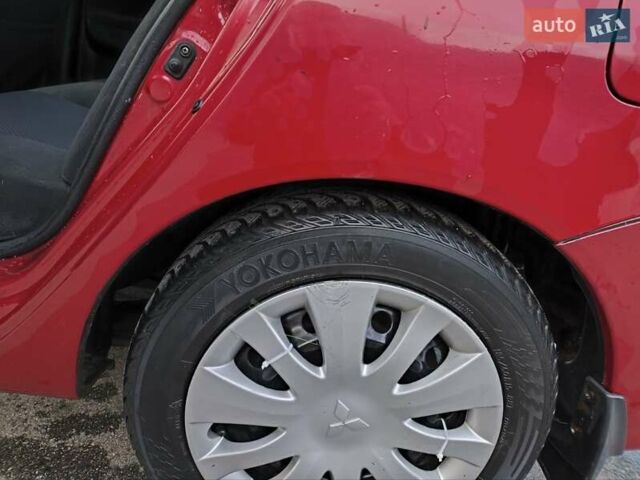 Червоний Міцубісі Lancer, об'ємом двигуна 1.58 л та пробігом 140 тис. км за 6000 $, фото 10 на Automoto.ua