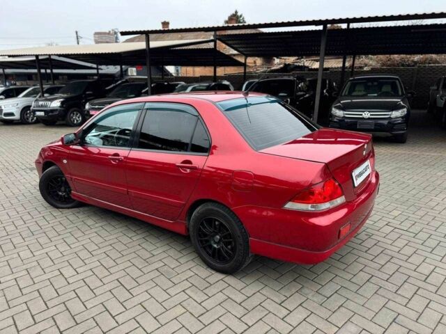 Красный Мицубиси Лансер, объемом двигателя 1.6 л и пробегом 215 тыс. км за 4500 $, фото 6 на Automoto.ua