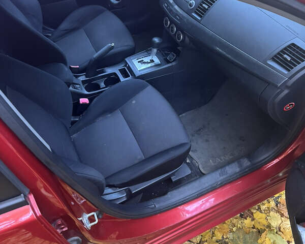 Червоний Міцубісі Lancer, об'ємом двигуна 2 л та пробігом 203 тис. км за 8000 $, фото 27 на Automoto.ua