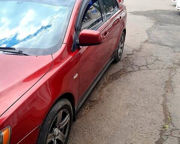 Червоний Міцубісі Lancer, об'ємом двигуна 2 л та пробігом 168 тис. км за 6800 $, фото 1 на Automoto.ua