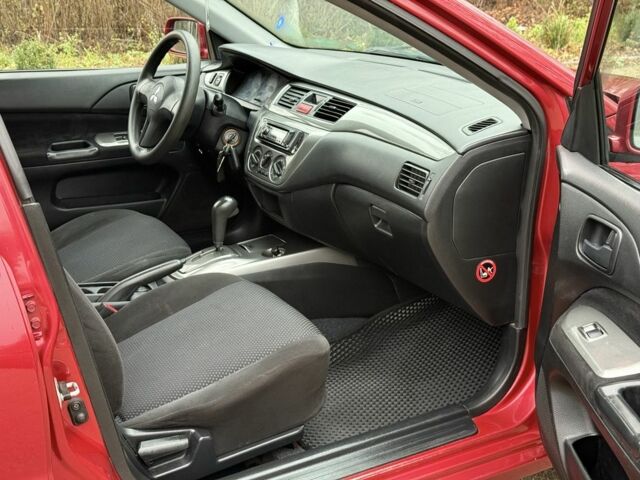 Червоний Міцубісі Lancer, об'ємом двигуна 1.6 л та пробігом 220 тис. км за 4600 $, фото 14 на Automoto.ua