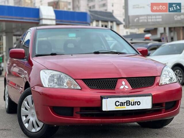 Червоний Міцубісі Lancer, об'ємом двигуна 1.58 л та пробігом 223 тис. км за 6400 $, фото 3 на Automoto.ua