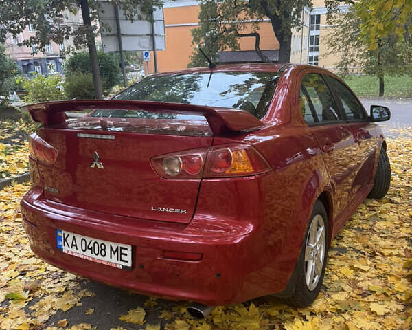 Червоний Міцубісі Lancer, об'ємом двигуна 2 л та пробігом 203 тис. км за 8000 $, фото 14 на Automoto.ua