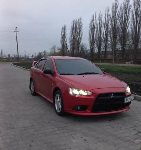 Красный Мицубиси Лансер, объемом двигателя 2 л и пробегом 200 тыс. км за 6000 $, фото 1 на Automoto.ua