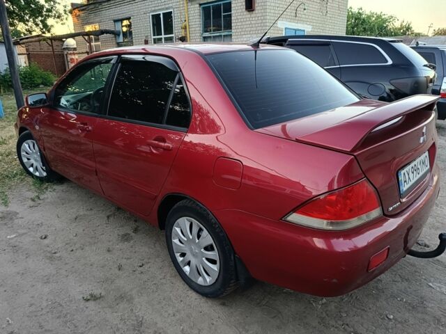 Червоний Міцубісі Lancer, об'ємом двигуна 1.6 л та пробігом 227 тис. км за 5300 $, фото 4 на Automoto.ua