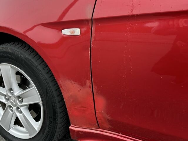 Красный Мицубиси Лансер, объемом двигателя 2 л и пробегом 366 тыс. км за 6500 $, фото 11 на Automoto.ua