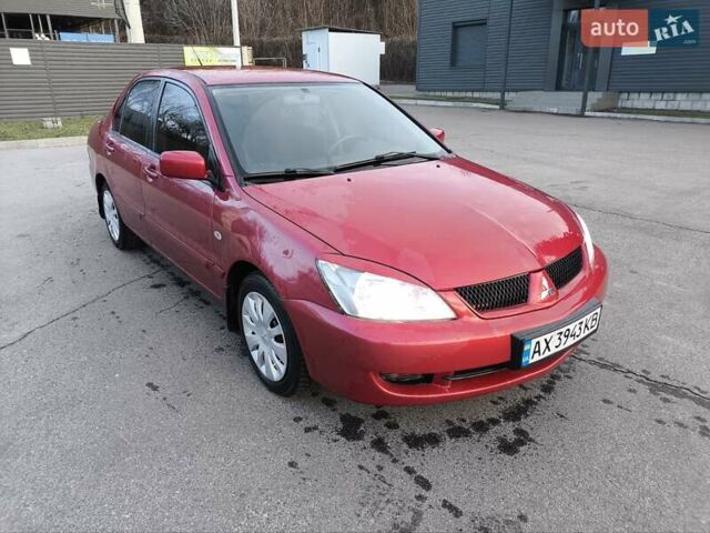 Червоний Міцубісі Lancer, об'ємом двигуна 1.58 л та пробігом 140 тис. км за 6000 $, фото 2 на Automoto.ua