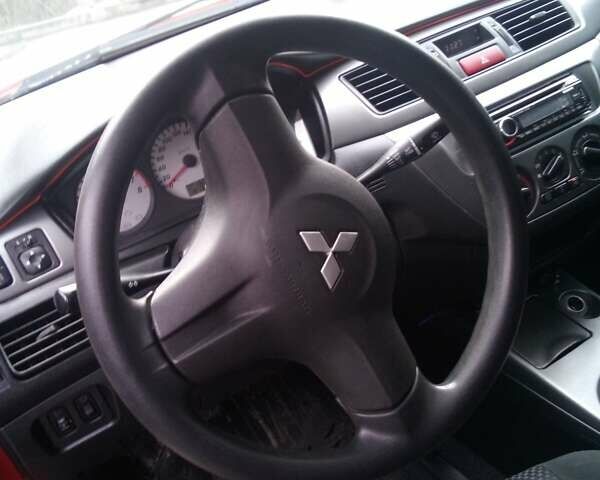 Червоний Міцубісі Lancer, об'ємом двигуна 1.6 л та пробігом 191 тис. км за 4900 $, фото 5 на Automoto.ua