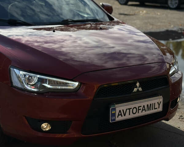 Червоний Міцубісі Lancer, об'ємом двигуна 2 л та пробігом 215 тис. км за 6500 $, фото 27 на Automoto.ua