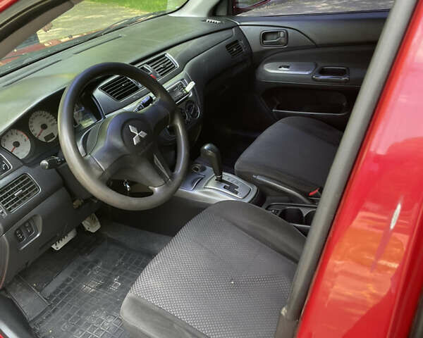 Червоний Міцубісі Lancer, об'ємом двигуна 1.6 л та пробігом 270 тис. км за 5699 $, фото 52 на Automoto.ua