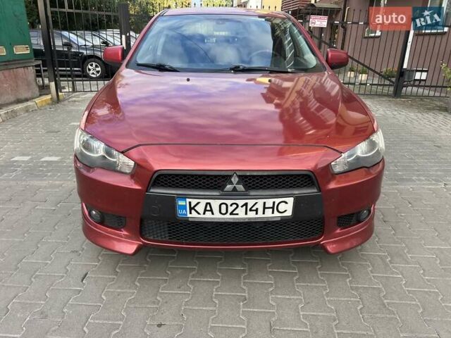 Красный Мицубиси Лансер, объемом двигателя 2 л и пробегом 189 тыс. км за 5200 $, фото 1 на Automoto.ua