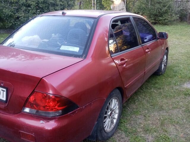 Червоний Міцубісі Lancer, об'ємом двигуна 1.6 л та пробігом 240 тис. км за 2030 $, фото 4 на Automoto.ua