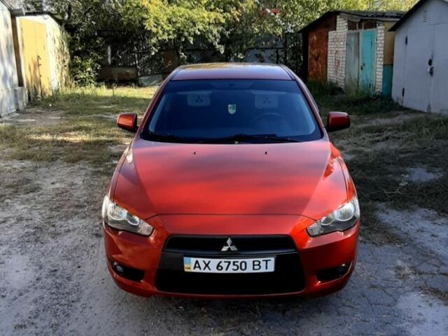 Красный Мицубиси Лансер, объемом двигателя 2 л и пробегом 110 тыс. км за 7500 $, фото 1 на Automoto.ua