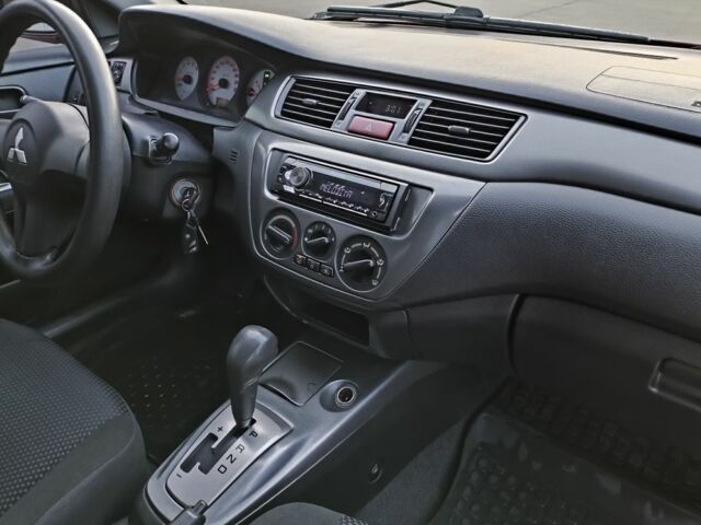 Червоний Міцубісі Lancer, об'ємом двигуна 1.6 л та пробігом 140 тис. км за 6000 $, фото 14 на Automoto.ua