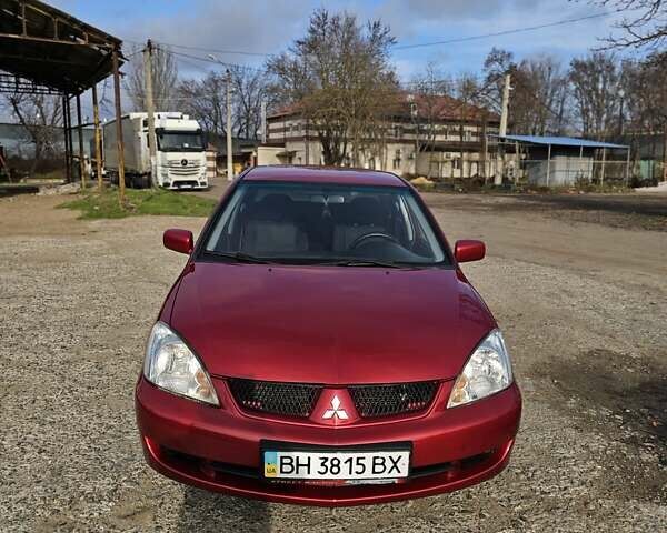 Червоний Міцубісі Lancer, об'ємом двигуна 1.6 л та пробігом 220 тис. км за 5800 $, фото 1 на Automoto.ua