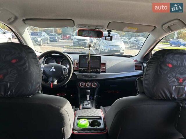 Красный Мицубиси Лансер, объемом двигателя 2 л и пробегом 227 тыс. км за 7000 $, фото 15 на Automoto.ua