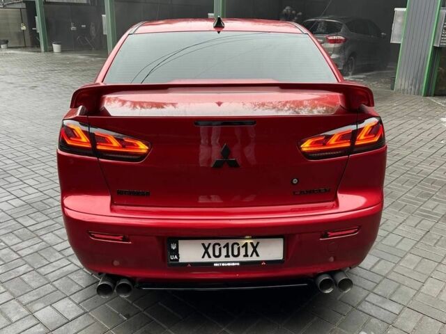 Червоний Міцубісі Lancer, об'ємом двигуна 2 л та пробігом 137 тис. км за 8500 $, фото 1 на Automoto.ua