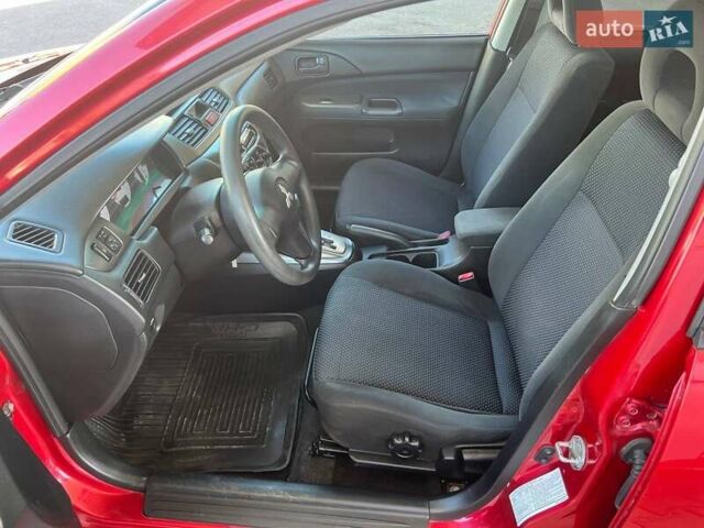 Червоний Міцубісі Lancer, об'ємом двигуна 1.58 л та пробігом 223 тис. км за 6400 $, фото 20 на Automoto.ua