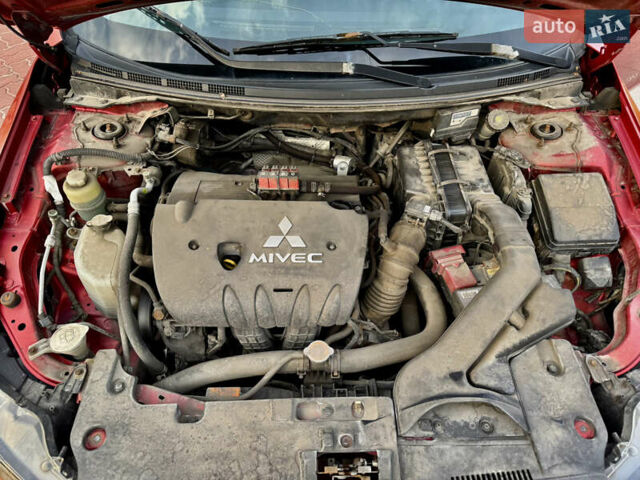 Красный Мицубиси Лансер, объемом двигателя 2 л и пробегом 365 тыс. км за 5000 $, фото 32 на Automoto.ua
