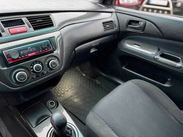 Красный Мицубиси Лансер, объемом двигателя 1.6 л и пробегом 215 тыс. км за 4500 $, фото 13 на Automoto.ua