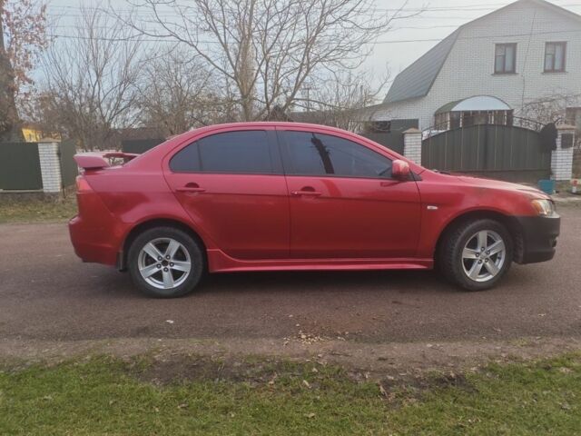 Червоний Міцубісі Lancer, об'ємом двигуна 2 л та пробігом 300 тис. км за 3950 $, фото 1 на Automoto.ua
