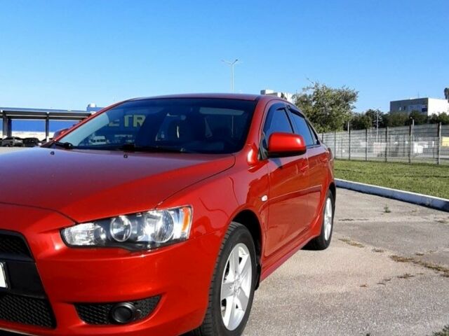 Красный Мицубиси Лансер, объемом двигателя 2 л и пробегом 110 тыс. км за 7500 $, фото 5 на Automoto.ua