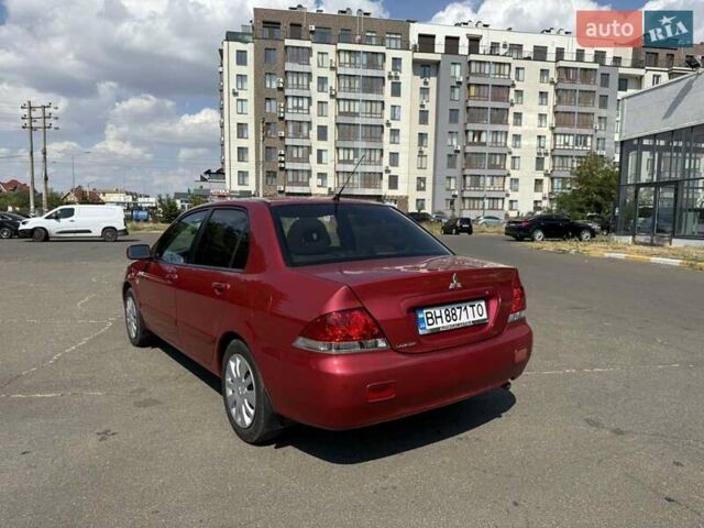 Красный Мицубиси Лансер, объемом двигателя 1.58 л и пробегом 223 тыс. км за 6000 $, фото 3 на Automoto.ua