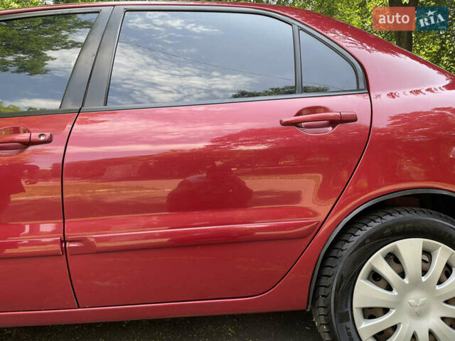 Червоний Міцубісі Lancer, об'ємом двигуна 1.6 л та пробігом 270 тис. км за 5699 $, фото 14 на Automoto.ua