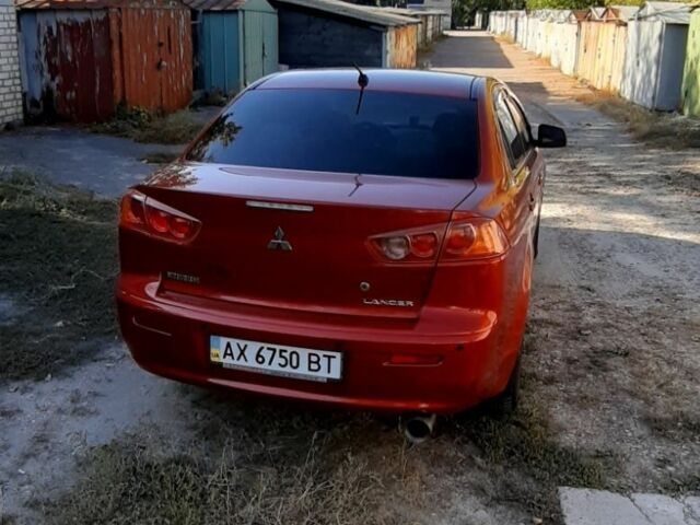 Красный Мицубиси Лансер, объемом двигателя 2 л и пробегом 110 тыс. км за 7500 $, фото 2 на Automoto.ua