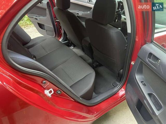 Красный Мицубиси Лансер, объемом двигателя 1.5 л и пробегом 124 тыс. км за 7100 $, фото 6 на Automoto.ua
