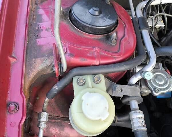 Червоний Міцубісі Lancer, об'ємом двигуна 1.58 л та пробігом 140 тис. км за 6000 $, фото 25 на Automoto.ua