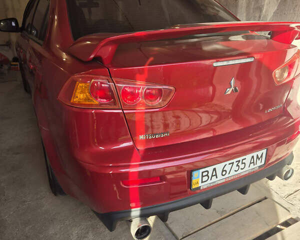 Красный Мицубиси Лансер, объемом двигателя 2 л и пробегом 65 тыс. км за 9300 $, фото 6 на Automoto.ua