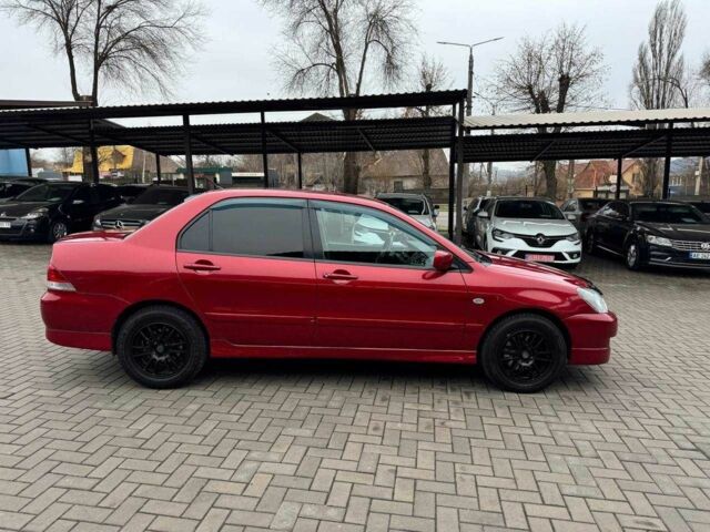 Красный Мицубиси Лансер, объемом двигателя 1.6 л и пробегом 215 тыс. км за 4500 $, фото 10 на Automoto.ua