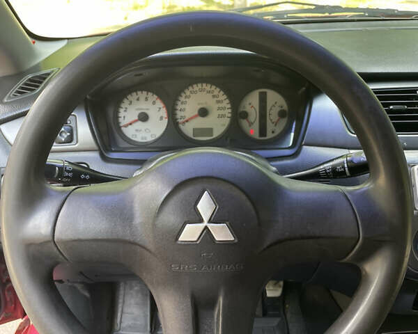 Червоний Міцубісі Lancer, об'ємом двигуна 1.6 л та пробігом 270 тис. км за 5699 $, фото 41 на Automoto.ua