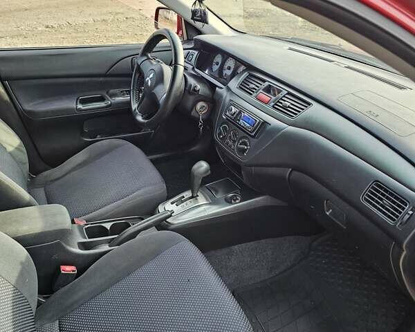 Червоний Міцубісі Lancer, об'ємом двигуна 1.6 л та пробігом 220 тис. км за 5800 $, фото 11 на Automoto.ua