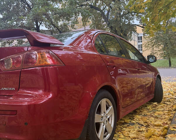 Червоний Міцубісі Lancer, об'ємом двигуна 2 л та пробігом 203 тис. км за 8000 $, фото 24 на Automoto.ua