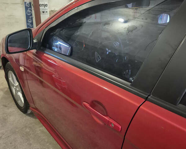 Красный Мицубиси Лансер, объемом двигателя 2 л и пробегом 65 тыс. км за 9300 $, фото 8 на Automoto.ua