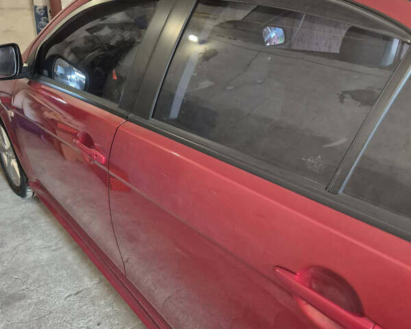 Красный Мицубиси Лансер, объемом двигателя 2 л и пробегом 65 тыс. км за 9300 $, фото 1 на Automoto.ua