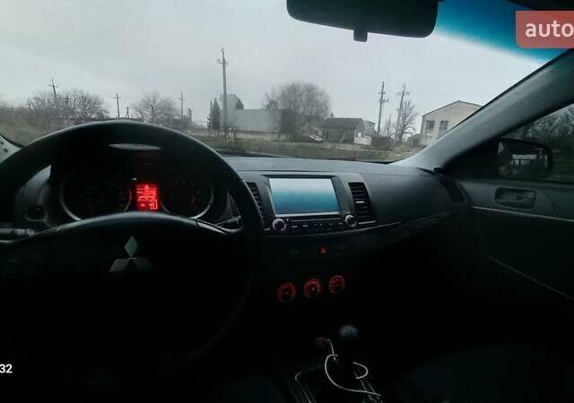 Красный Мицубиси Лансер, объемом двигателя 2 л и пробегом 200 тыс. км за 6000 $, фото 8 на Automoto.ua