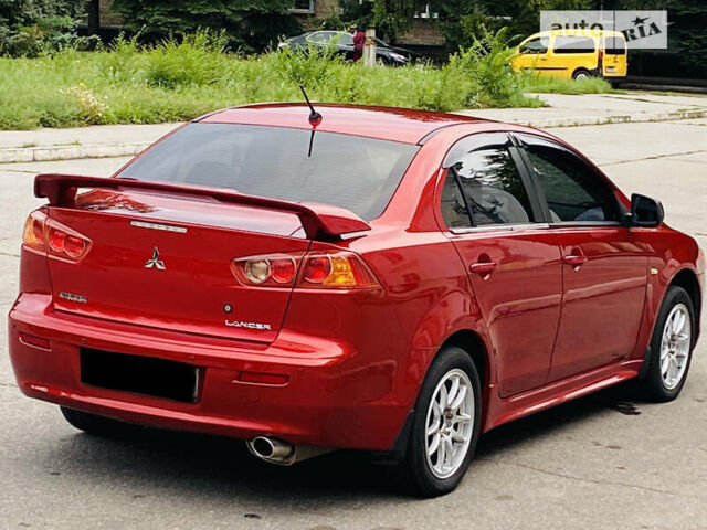 Червоний Міцубісі Lancer, об'ємом двигуна 2 л та пробігом 210 тис. км за 7200 $, фото 8 на Automoto.ua