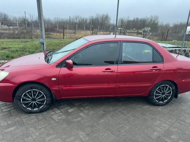 Красный Мицубиси Лансер, объемом двигателя 1.6 л и пробегом 265 тыс. км за 2956 $, фото 2 на Automoto.ua