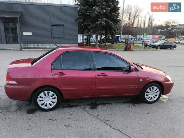 Червоний Міцубісі Lancer, об'ємом двигуна 1.58 л та пробігом 140 тис. км за 6000 $, фото 23 на Automoto.ua
