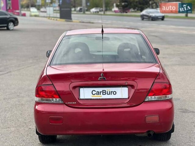 Червоний Міцубісі Lancer, об'ємом двигуна 1.58 л та пробігом 223 тис. км за 6400 $, фото 10 на Automoto.ua