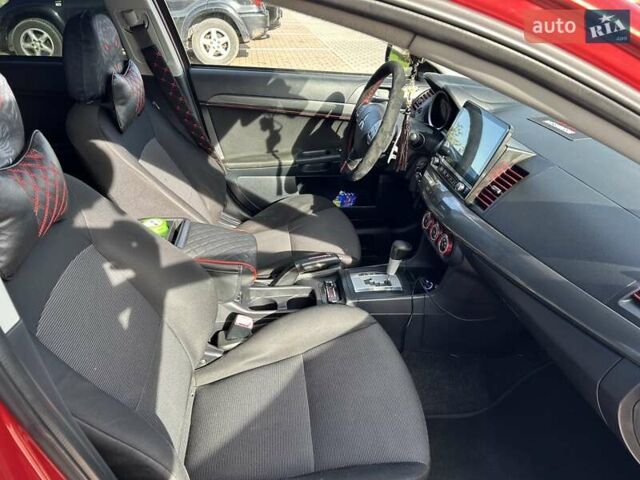 Красный Мицубиси Лансер, объемом двигателя 2 л и пробегом 227 тыс. км за 7000 $, фото 17 на Automoto.ua