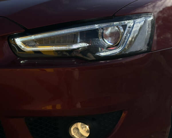 Червоний Міцубісі Lancer, об'ємом двигуна 2 л та пробігом 215 тис. км за 6500 $, фото 26 на Automoto.ua