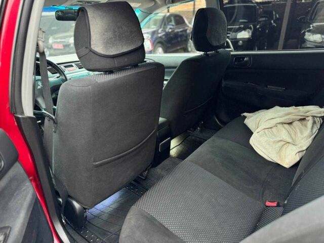 Красный Мицубиси Лансер, объемом двигателя 1.6 л и пробегом 215 тыс. км за 4500 $, фото 14 на Automoto.ua