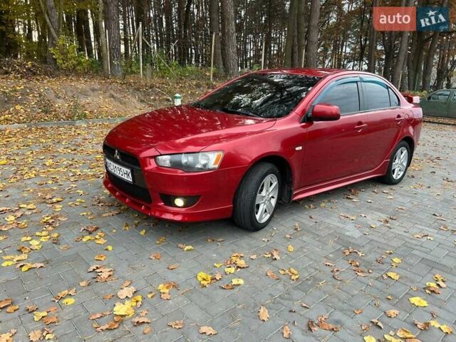 Красный Мицубиси Лансер, объемом двигателя 2 л и пробегом 197 тыс. км за 6500 $, фото 3 на Automoto.ua